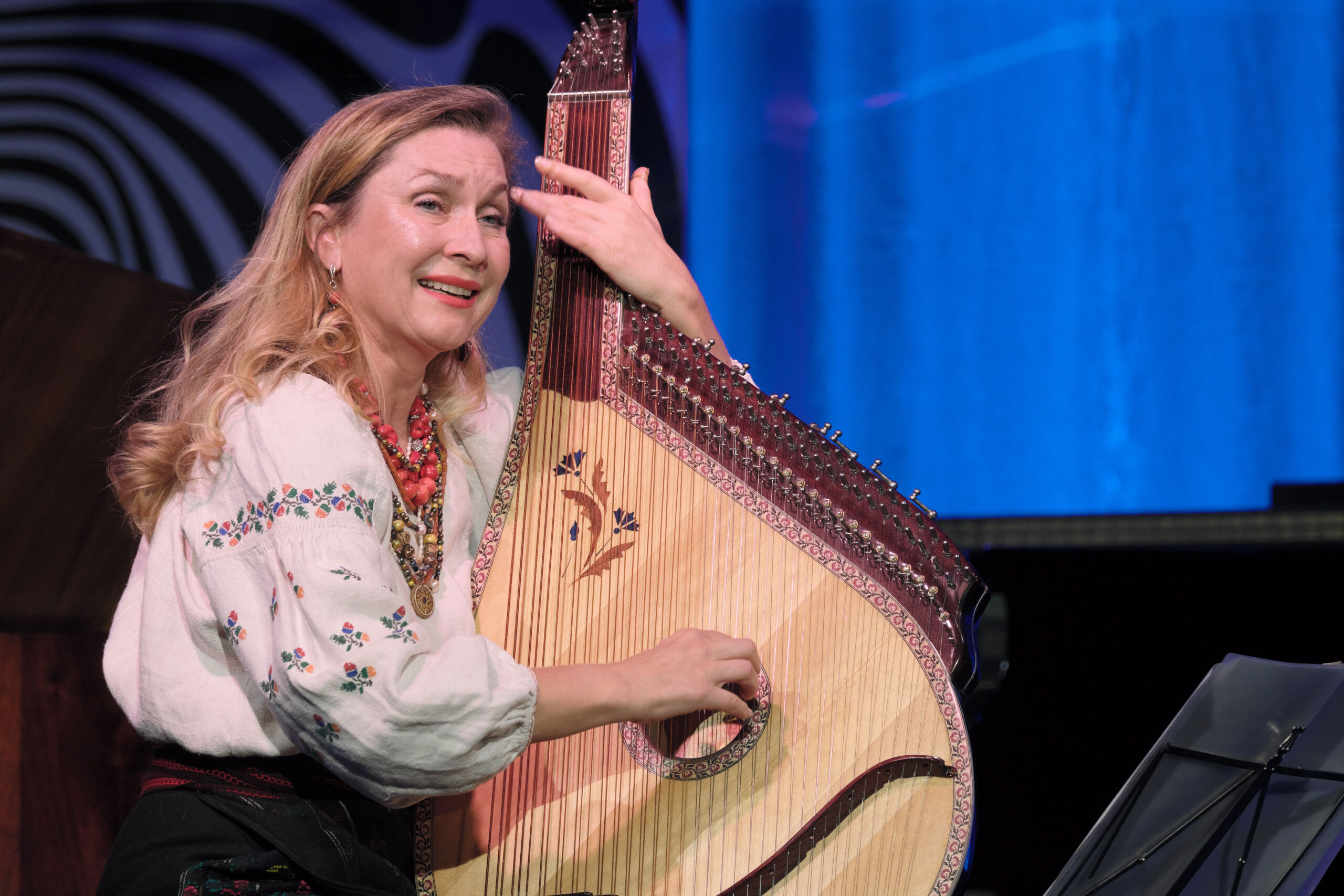 Larissa Kovalchuk performs on a bandura, a Ukrainian plucked string folk instrument, during <i>The Last Mile</i>, the final concert of the 2022 Canberra International Music Festival. Photo © Peter Hislop.